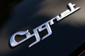 Aston Martin Cygnet noir logo coffre debout