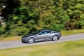 Aston Martin DBS anthracite profil travelling penché