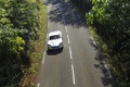 Aston Martin DBS gris face avant filé penché vue de haut debout