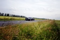 Aston Martin Rapide anthracite vue 3/4 arrière gauche large.