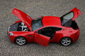 Aston Martin V8 Vantage rouge profil ouvrants vue de haut