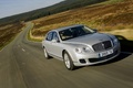 Bentley Continental Flying Spur Speed blanc 3/4 avant droit travelling penché