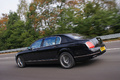 Bentley Continental Flying Spur Speed noir 3/4 arrière gauche travelling penché 3