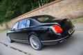 Bentley Continental Flying Spur Speed noir 3/4 arrière gauche travelling penché