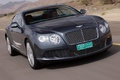 Bentley Continental GT anthracite 3/4 avant droit travelling penché debout