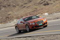 Bentley Continental GT orange 3/4 avant droit filé penché