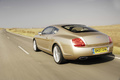 Bentley Continental GT Speed beige 3/4 arière gauche travelling 2