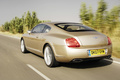 Bentley Continental GT Speed beige 3/4 arrière gauche travelling