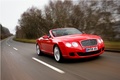 Bentley Continental GTC rouge 3/4 avant droit travelling penché