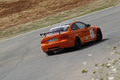 BMW M3 E92 GTS orange 3/4 arrière droit filé penché