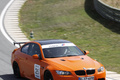 BMW M3 E92 GTS orange 3/4 avant droit filé debout