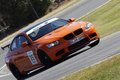 BMW M3 E92 GTS orange 3/4 avant droit filé penché