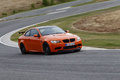 BMW M3 E92 GTS orange 3/4 avant droit filé