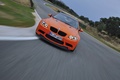 BMW M3 E92 GTS orange face avant travelling penché 4