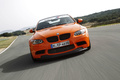 BMW M3 E92 GTS orange face avant travelling penché