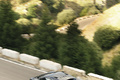 Bugatti Veyron Super Sport carbone bleu 3/4 arrière gauche filé vue de haut debout