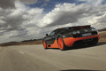 Bugatti Veyron Super Sport noir/orange 3/4 arrière gauche travelling penché
