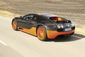 Bugatti Veyron Super Sport noir/orange 3/4 arrière gauche travelling