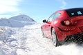 Ferrari FF rouge 3/4 arrière gauche coupé penché