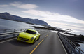 Mercedes SLS AMG E-Cell jaune 3/4 avant gauche travelling vue de haut penché 3