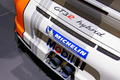 Mondial de l'Automobile Paris 2010 - Porsche 997 GT3 R Hybrid blanc/orange échappement