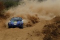 Porsche 911 bleue, action face, poussière