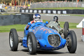 Mazda Grand Prix, bleu, action 3-4 avd