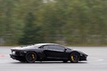 GT Prestige 2012 - Lamborghini Aventador LP700-4 noir 3/4 arrière droit filé