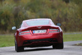 Aston Martin DB9 rouge face arrière 2