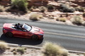 Aston Martin V12 Vantage S Roadster - rouge - profil droit dynamique penché