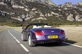 Bentley Continental GTC V8 violet 3/4 arrière gauche travelling