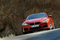 BMW M6 orange face avant penché