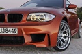 BMW Série 1M orange 3/4 avant gauche coupé