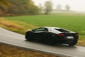 Lamborghini Aventador noir 3/4 arrière gauche filé penché 2