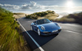 Porsche 991 Carrera 4 Cabriolet bleu 3/4 avant droit travelling penché