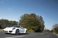 Porsche 991 Carrera 4S Cabriolet blanc 3/4 avant gauche travelling penché