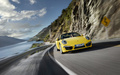 Porsche 991 Carrera 4S Cabriolet jaune face avant travelling penché