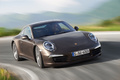 Porsche 991 Carrera 4S marron 3/4 avant droit travelling penché