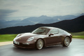 Porsche 991 Carrera 4S marron 3/4 avant gauche travelling