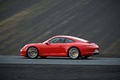 Porsche 991 Carrera rouge 3/4 arrière gauche filé