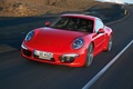Porsche 991 Carrera rouge 3/4 avant gauche travelling penché 2