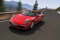 Porsche 991 Carrera S Cabriolet rouge 3/4 avant gauche travelling penché