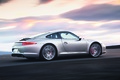 Porsche 991 Carrera S gris 3/4 arrière droit travelling penché