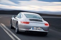 Porsche 991 Carrera S gris 3/4 arrière gauche travelling penché