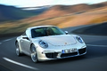 Porsche 991 Carrera S gris 3/4 avant droit travelling penché