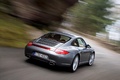 Porsche 997 Carrera 4 MkII anthracite 3/4 arrière droit travelling penché