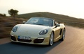 Porsche Boxster - jaune - 3/4 avant gauche, dynamique