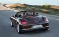 Porsche Boxster - marron - 3/4 arrière gauche, dynamique